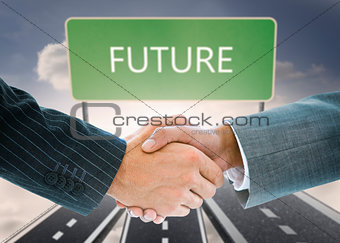 Composite image of business handshake against future board