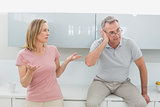 Couple having an argument in kitchen