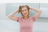Displeased woman pulling her hair