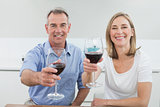 Portrait of a couple holding wine glasses