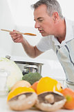 Man preparing food with vegetables in foreground