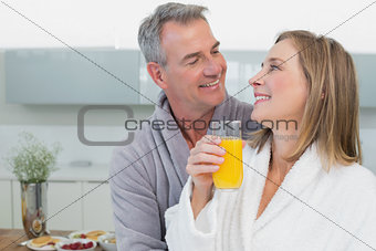 Loving couple looking at each other in kitchen