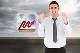 Composite image of portrait of a cheerful businessman with the fists up