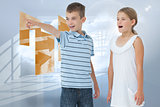 Composite image of young boy showing something to his sister