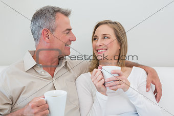 Relaxed loving couple with coffee cups