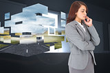 Composite image of concentrating businesswoman