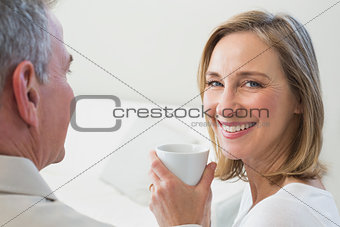 Close-up of a relaxed couple with coffee cup
