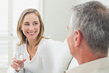 Relaxed couple with a glass of water