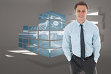 Composite image of happy businessman standing with hands in pockets