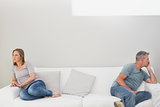 Unhappy couple not talking after an argument at home