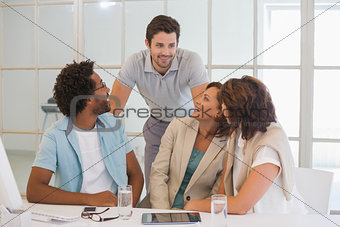 Business people having a conversation at office desk