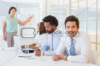 Businessman with colleagues in boardroom meeting