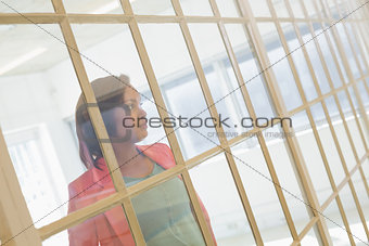 Serious businesswoman looking away at office