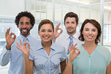 Business colleagues gesturing okay sign