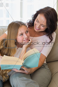 Mother and daughter with story book