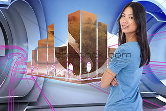Composite image of smiling asian woman with arms crossed looking over her shoulder