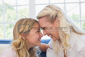 Woman and daughter looking at each other