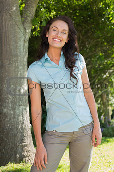 Happy woman standing in park