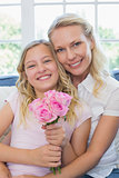 Mother and daughter with rose bouquet