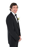 Handsome groom in tuxedo smiling