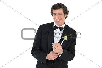 Man adjusting cuff links before wedding