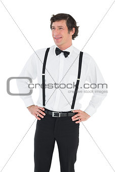 Handsome groom with hands on hips