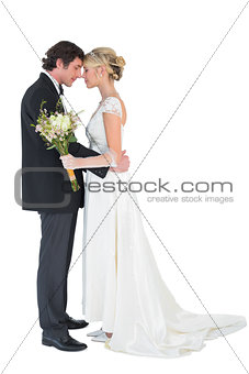 Loving bride and groom with head to head