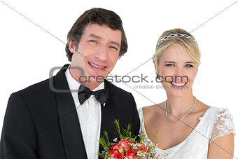 Newly wed couple smiling over white background