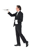 Waiter carrying tray over white background