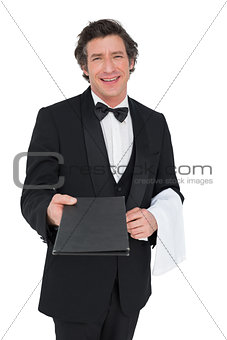 Confident waiter giving bill pad over white background