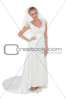 Confident bride with hand on waist