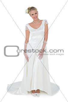 Beautiful bride standing over white background