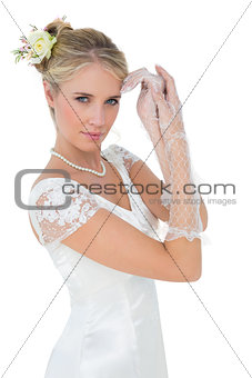 Sensuous bride posing over white background