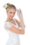 Smiling bride posing over white background