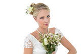 Bride holding bouquet against white background