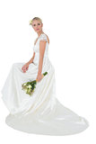 Portrait of bride holding bouquet over white background