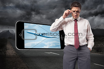Composite image of thinking businessman touching his glasses