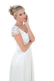 Pretty bride standing over white background