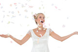Beautiful bride being showered with petals
