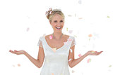 Bride being showered with petals over white background