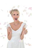 Surprised bride being showered with petals