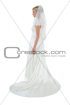 Full length of woman in wedding dress looking away