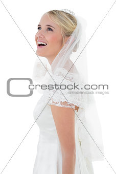 Surprised woman in wedding dress over white background