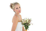 Bride with flower bouquet over white background