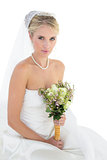 Portrait of bride holding flower bouquet