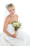 Bride holding bouquet over white background
