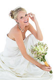 Happy bride holding flower bouquet