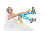 Bride wearing sports shoes over white background