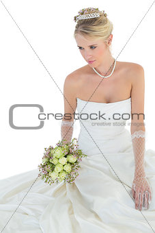 Elegant bride holding flower bouquet