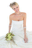 Portrait of happy bride holding rose bouquet